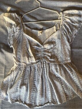 Women’s Light Blue Printed Peplum Blouse with Ruched Front